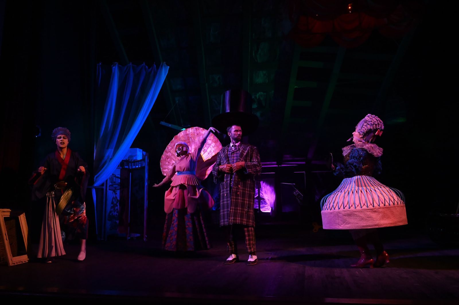 Costumed performers under colored stage lights, the kind of show behind the best cruise entertainment